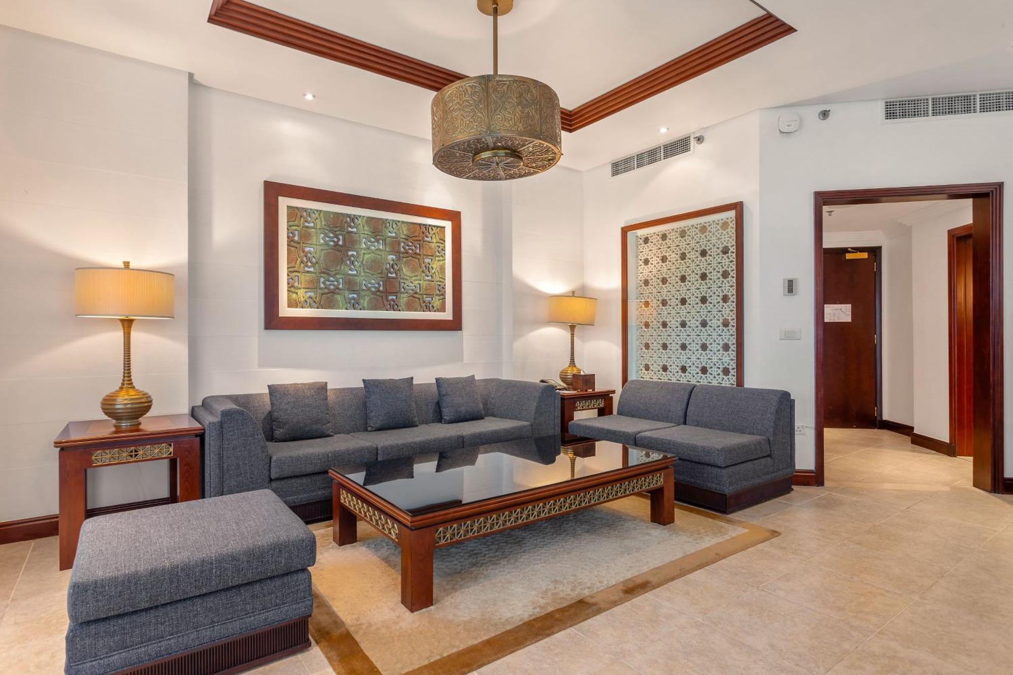 Ajman Hotel & Villas By Blazon Hotels Bagian luar foto A living room at the hotel